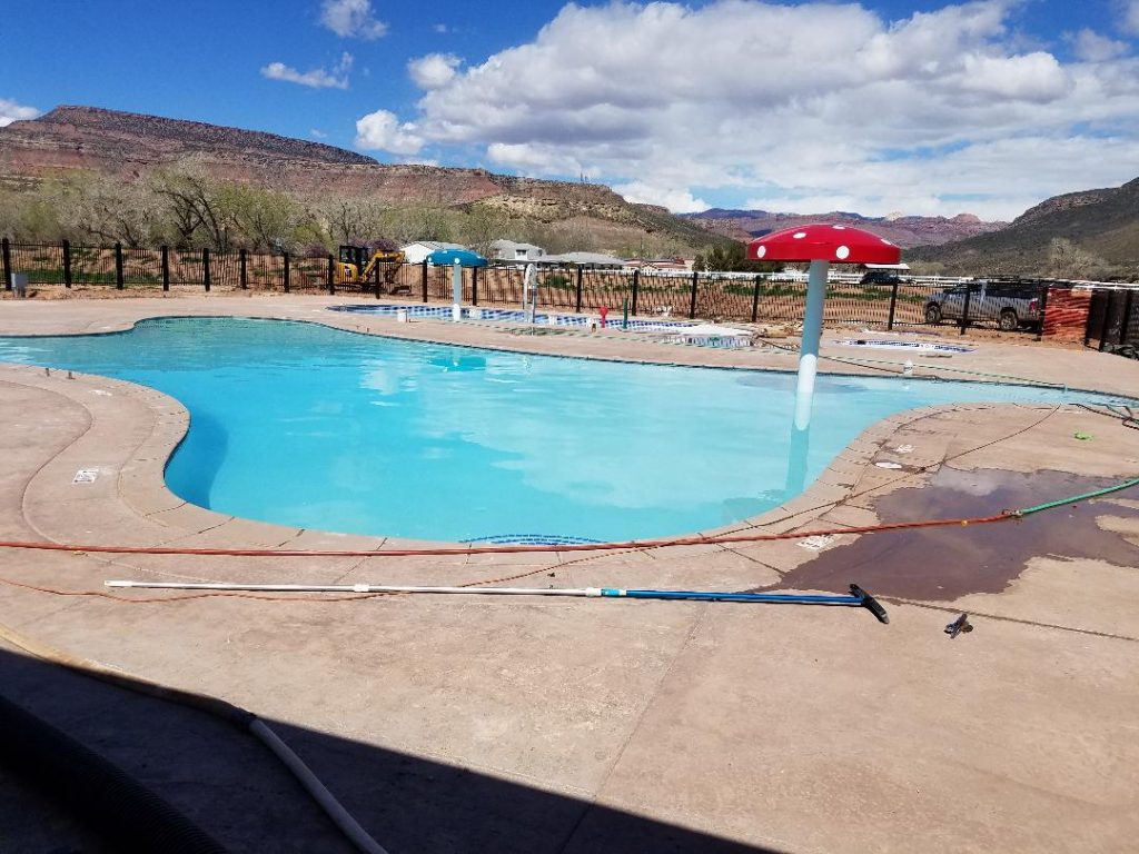 The area around the oversized swimming pool near Virgin, Ut is perfect for lounging in the sun.