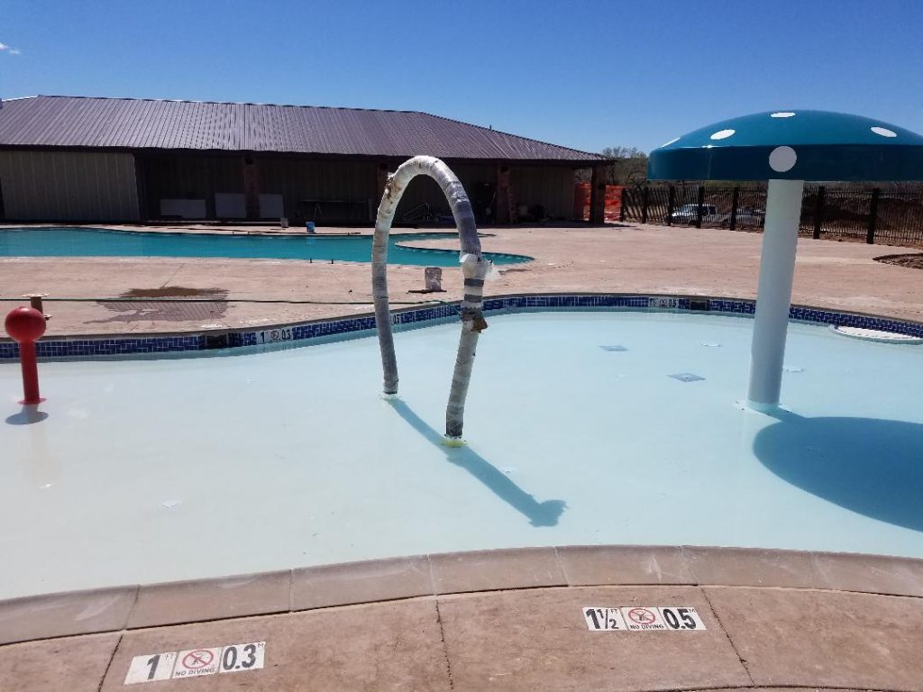 Kiddie pool splash pad area of commercial swimming pool for Fairfield Inn and Suites by Marriott in Springdale.