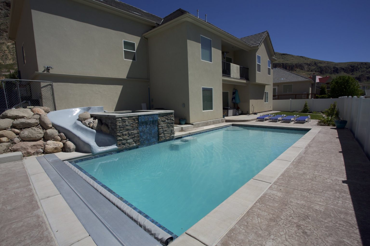 Inground Swimming Pool With Waterfall Feature and Spa In Hurricane, Ut