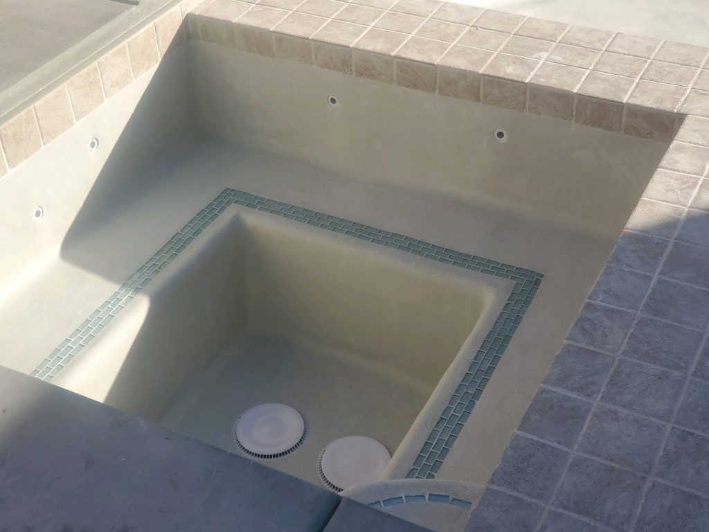 Spa with tile inlay into seating.